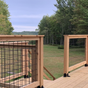 U.S.S. hog panel deck railing overlooking green trees, Reliance Timber