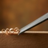 Carving wood with a chisel, a woodworking tool.